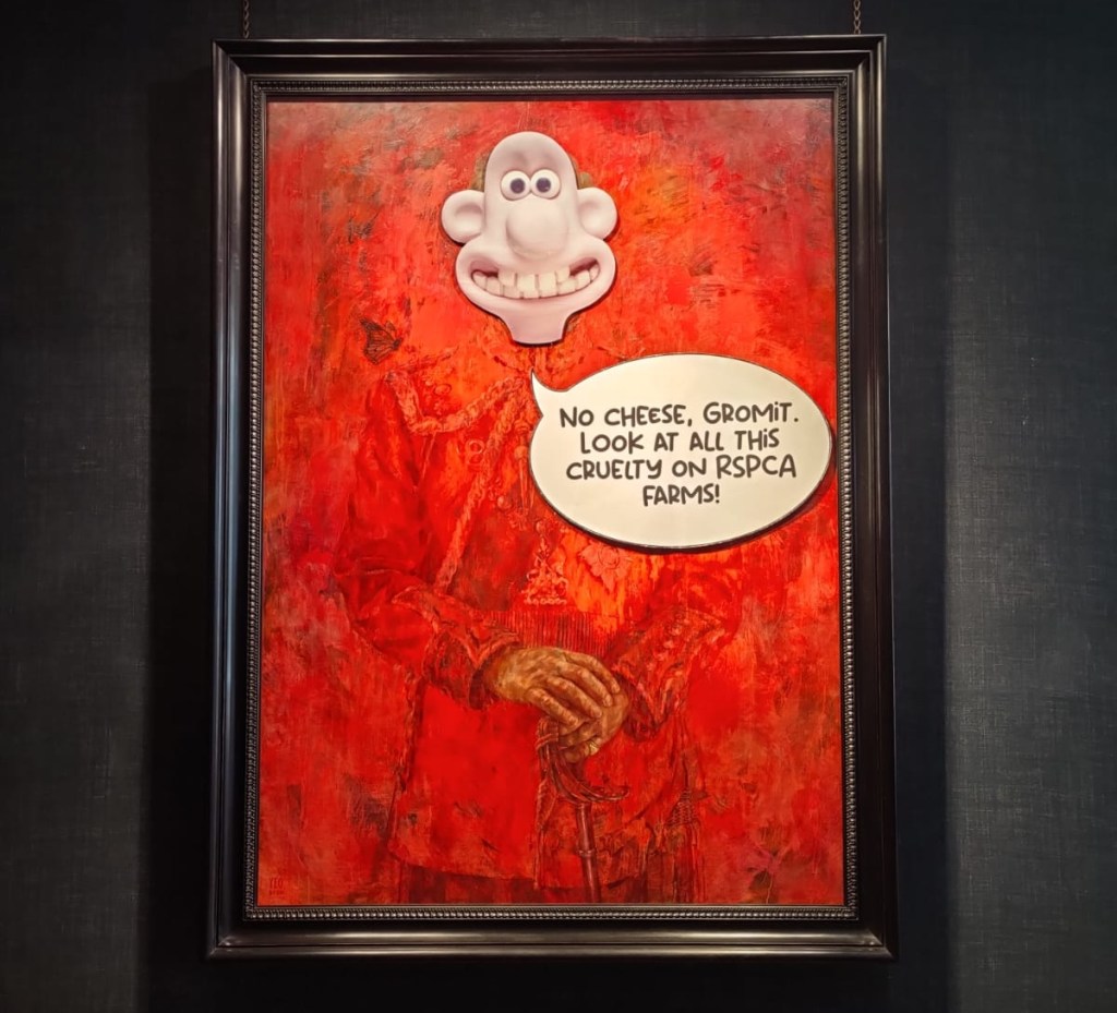 Portrait of King Charles III with Wallace mask and “No Cheese, Gromit. Look At All This Cruelty On RSPCA Farms!” speech bubble